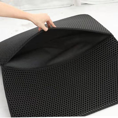 Cat litter mat being held open