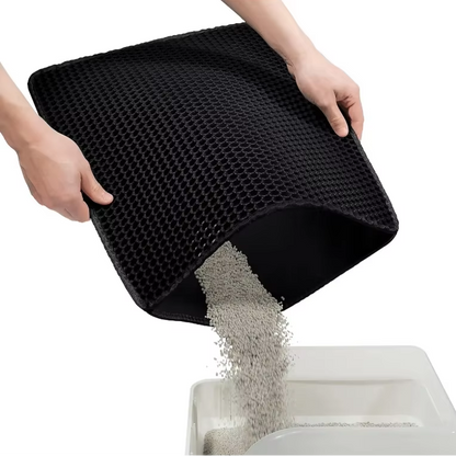 Cat litter trapping mat being emptied