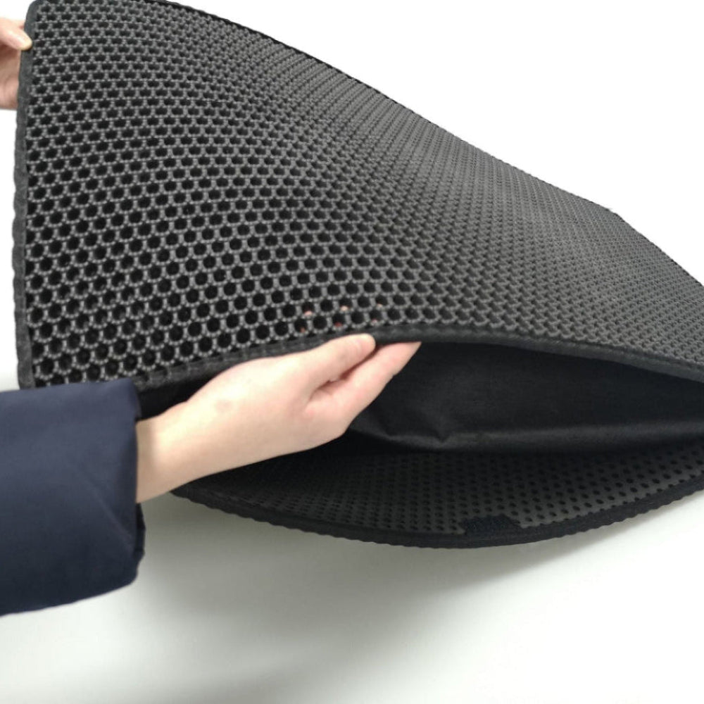 Cat litter mat being held open